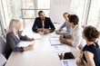 © fizkes - Morning briefing event of multi-ethnic designer in company conference room. Group of businesspeople, partners employees gathered together to discuss joint task, prepare marketing plan, work on project