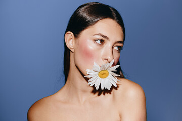 Poster - Natural Beauty: Young Woman with Flowers, Radiant and Serene, on a Clean Studio Background