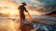 An Asian fisherman catches fish with a net on the ocean shore. He hunts at sunset in autumn, wearing his local clothes and hat