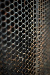 Poster - Detailed shot of a metal grate with holes. Ideal for industrial or architectural projects