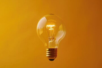 Poster - A light bulb with a yellow background. Suitable for various concepts