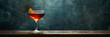 Cocktail with orange twist in a coupe glass on rustic bar counter. Bar ambiance concept for design and menu