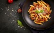 Pasta alla norma - traditional Italian food with eggplant, tomato, ricotta cheese and basil