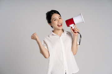 Wall Mural - Portrait of beautiful asian woman posing on white background