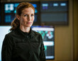 © Flash - photo of beautiful woman as a commander agent wearing black long sleeve shirt and tactical pant with monitor and screen in control command room, generative AI