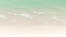 The Soft Wave Water Of The Sea On The Sandy Beach Background	