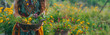 Panoramic banner with woman holding a bowl of fresh picked wildflowers in meadow
