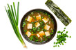 Japanese miso soup with tofu, seaweed, green onions, and miso paste dissolved in dashi broth.