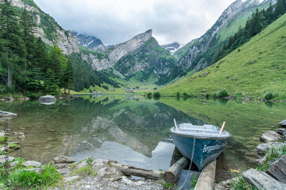 Beautiful summer view on lake Seealpsee in the Swiss alps, 2 rowing ...