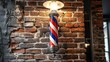 a brick wall marked with a barber's sign