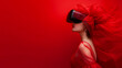 a girl in a red vr headset and red background on the isolated hue background