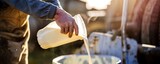 Farmers pour raw milk into containers, and it is ready for the next process
