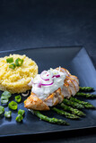 Fototapeta Most - Green asparagus with grilled chicken fillet and couscous
