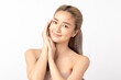 © Shutter B - Happy beautiful young asian woman smile touching her face on white background, clean fresh bare skin concept. Facial treatment, Perfect skin, Natural make up.
