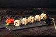 Sushi rolls Japanese food, set on a dark background