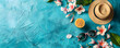 © jex - Top view flat lay of a summer background featuring starfish, oranges, beach hat, glasses, and palm leaves. A blue turquoise summer composition with space for copy or text.