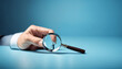 Magnifying glass searching for people on blue background, employment candidate hunt