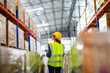 © ultramansk - operation worker woman checking and inspecting cargo for stack items for shipping. Staff checking the store factory. industry factory warehouse. Worker Scanning Package In Warehouse.