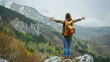 © Irina - Freedom traveler Woman standing with raised arms and enjoying a Beautiful nature.