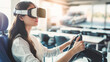 © Tetiana - Driving school. a young woman wearing virtual reality glasses learns driving in a driving school. a girl in VR glasses sits in a classroom and controls a virtual machine using the steering wheel.