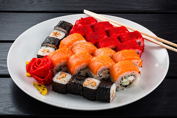 Wall Mural - Assorted Japanese sushi roll set with salmon, tuna, shrimp, avocado, Philadelphia cheese and cucumber.