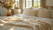 Close-up bed with beige bedding. Scandinavian interior design of modern bedroom.