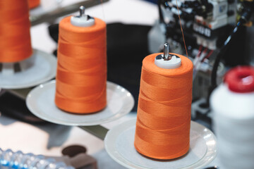 Aufkleber - Spools of color threads closeup, spinning machine
