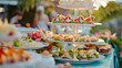 Outdoor Wedding or elegant party buffet table with fruity, sweet and salty appetizer little cake and bites 