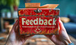 © Bartek - Red feedback box with paper feedback forms inside highlighting the importance of customer opinions, suggestions, and evaluations for service improvement