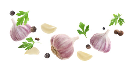 Wall Mural - Fresh garlic, peppercorns and parsley falling on white background