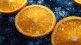Fototapeta Niebo -  a group of oranges sitting on top of a table covered in drops of water on top of a dark blue surface with drops of water on the top of the top of the oranges.