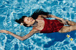 © SHOTPRIME STUDIO - Woman vacation pool female summer young lifestyle blue wet water beauty person body