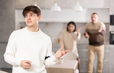 Wall Mural - Young guy leaves his family and home after a quarrel with relatives