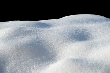 Wall Mural - white snow in daylight, background, isolate on black background