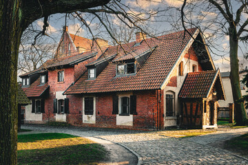 Wall Mural - Street in the Baltic village. Old brick abandoned house in the traditional style