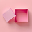 Pink pastel minimal opened gift box on pink background.