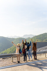 group of asian generation z people friends looking beautiful nature of countryside forest and mounta