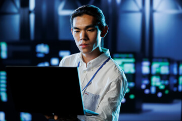 Poster - qualified engineer between server hub rows providing processing resources for businesses worldwide. 