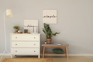 Poster - Interior of living room with modern wi-fi router on commode and bench