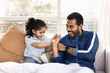 © fizkes - Positive young Indian dad playing fight with active little daughter kid, tickling, cuddling child, smiling, laughing, enjoying family leisure, playtime at ohme, fatherhood, closeness