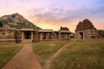 Wall Mural - Medieval Achyuta Raya temple with ancient archaeological ruins at sunset at Hampi, Karnataka, India.