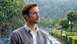 © James Nesterwitz - A pensive man standing outside in the rain