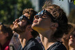 People wearing protective eye gear while looking at a solar eclipse