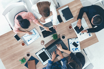 Poster - Top view of businessman executive in group meeting with other businessmen and businesswomen in modern office with laptop computer, coffee and document on table. People corporate business team uds