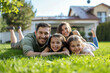 © Kien - Portrait of a smiling family relaxing in the backyard of a house
