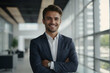 © Rahul - Head shot portrait of young happy confident businessman, client or investor. Smiling office worker, company employee, executive manager, salesman, male team leader, lawyer standing with folded hands.