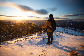 Wall Mural - Hiker in a wintry mountain landscape