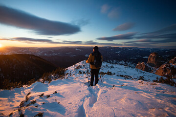 Wall Mural - Hiker in a wintry mountain landscape