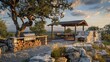 An outdoor kitchen with a grill and pizza oven is set up near a luxury safari tent high on a hilltop overlooking Possum Kingdom Lake in the late afternoon.