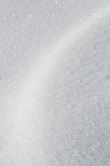 Wall Mural - curve of light on fresh white winter snow abstract textured background